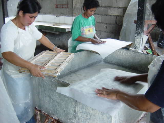 Scooping the boiled abaca pulp into molds